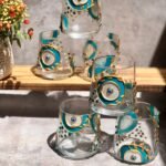 Painted turquoise leaves eyes on glass set